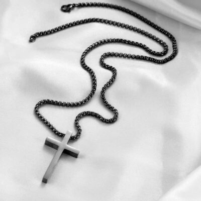 This Feng Shui Cross Necklace blends sacred symbolism with durable materials. Designed to offer both spiritual balance and modern style, it acts as a wearable talisman for protection, clarity, and inner discipline.

Spiritual Meaning of the Feng Shui Cross Necklace

The cross represents harmony between heaven and earth. In Feng Shui, it focuses directional energy and shields the heart from negativity. This makes it ideal for those seeking both strength and spiritual focus.

Why Titanium Steel Is Ideal for Feng Shui Jewelry

Titanium steel symbolizes resilience and clarity. In the Five Elements system, it enhances the metal element, which supports willpower, logic, and personal boundaries. Its clean lines also reflect a sharp and grounded mindset.

Energy Benefits of a Feng Shui Cross Necklace

This necklace helps reduce emotional turbulence and increases stability. It centers the wearer, especially during stress or transition. Wearing it daily boosts emotional clarity and supports a balanced flow of qi.

How to Wear It for Maximum Effect

For best results, wear it near the heart chakra. This supports emotional healing and protection. Cleanse the pendant regularly under moonlight or with incense to renew its energy.

A Versatile and Meaningful Gift

This necklace suits anyone drawn to spiritual symbolism. It makes a thoughtful gift for birthdays, transitions, or moments of empowerment. Its elegant form hides deep energy.
